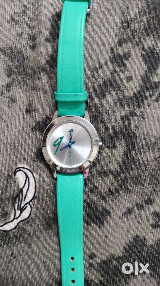 FASTRACK WATCH ( GREEN COLOUR WITH THE SILVER DIAL. )