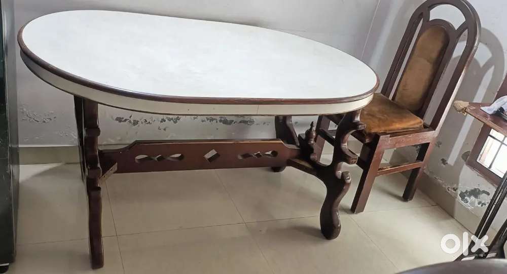 I am selling out my High quality Wooden table with 3 wooden chairs.
