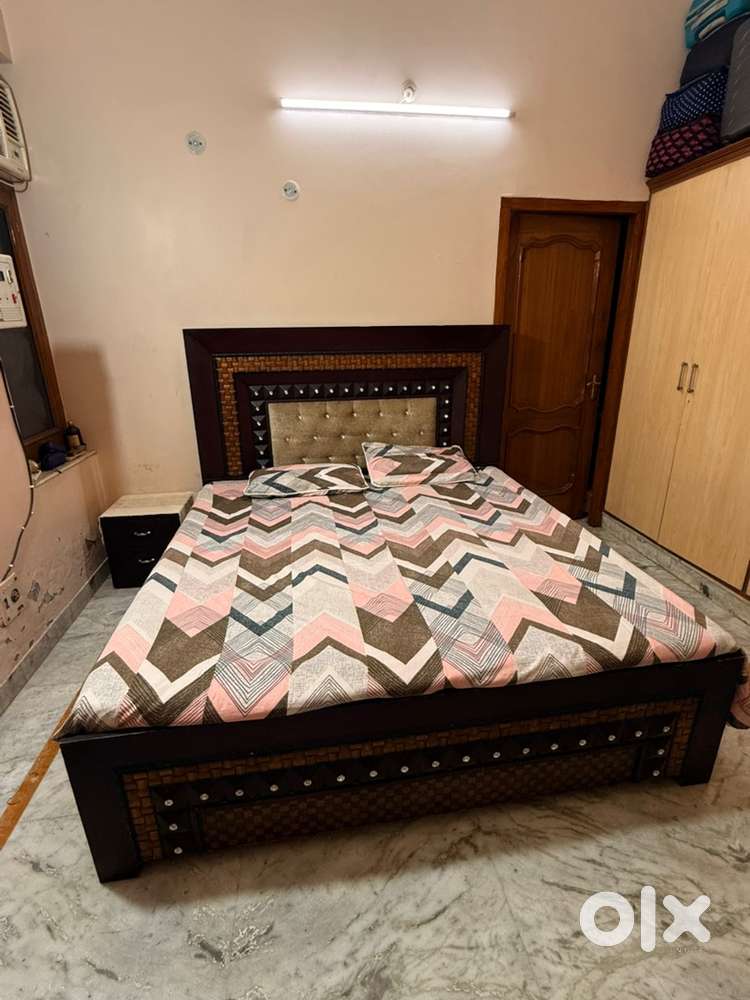 Double bed with side table