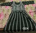 A green colour Kurti with a Chicken Kadhai on it