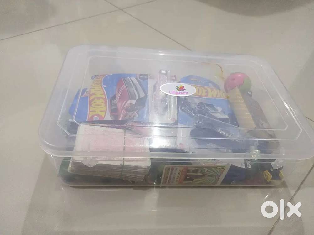 A toy box contains many toys