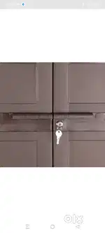 Cello plastic wardrobe with storage finish colour pearl brown .
