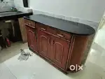 Kitchen cupboard with granite top + glass wall