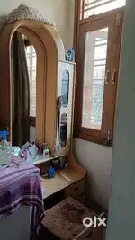 Dressing table with a sitting sofa/chair with it