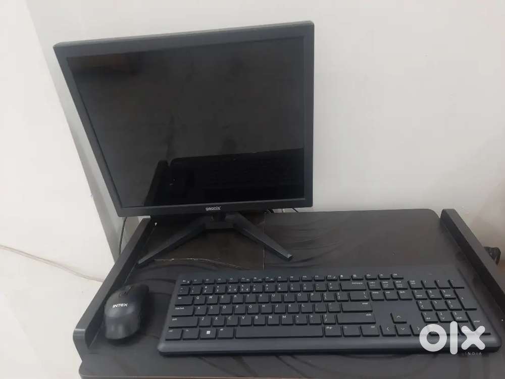 Computer with mouse and keyboard with chair