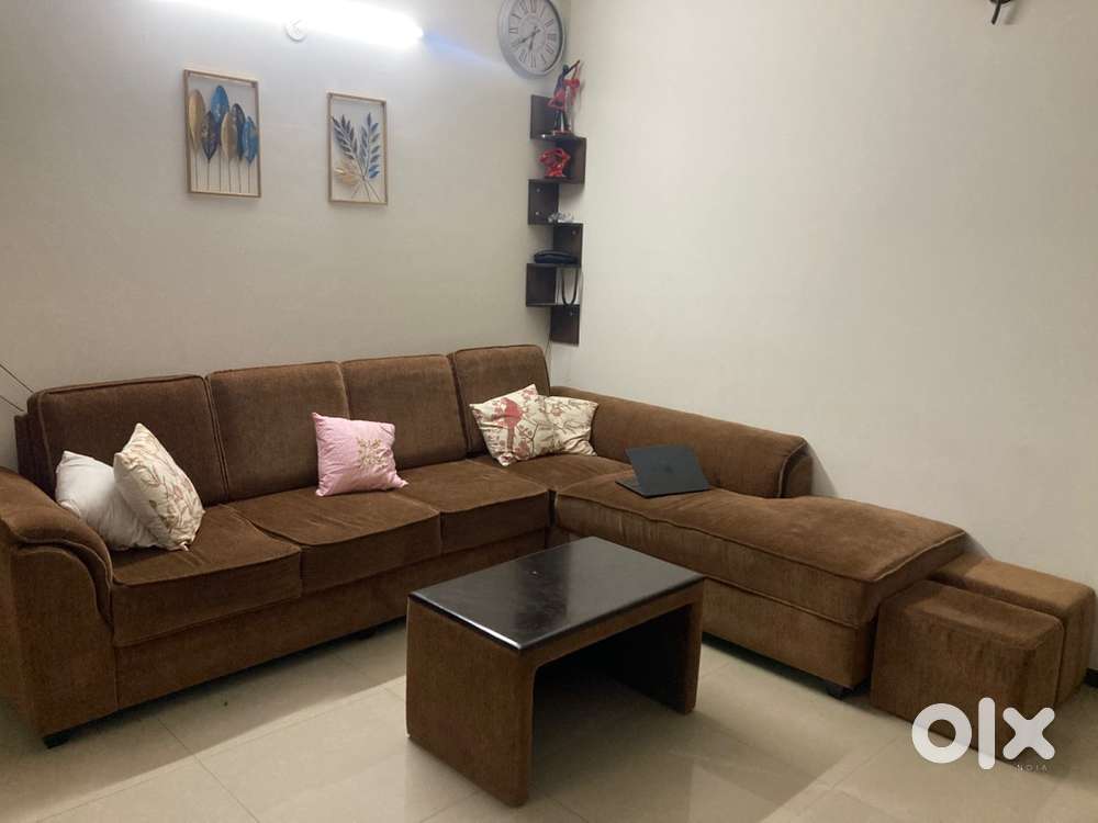 Well maintained L shaped Sofa + centre table + 2 ottoman