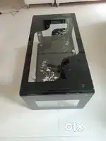 Good Condition Black Glass Centre Table with Newspaper Support On Sale