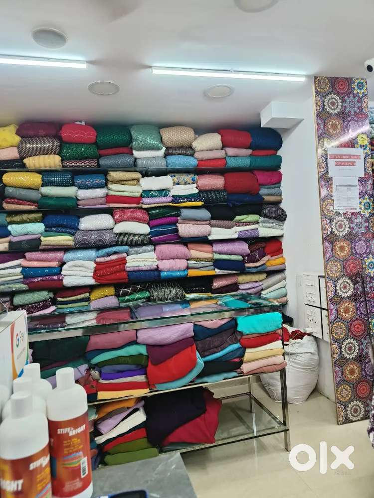 Ladies tailor billing staff male at a textile shop at Kolanchery