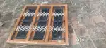 Wooden windows with ms grilland glass