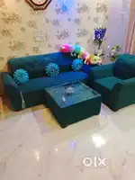 Dark royal green colour 5 seater sofa with center table
