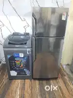 Samsung double door refrigerator and whirlpool top load washing machin
