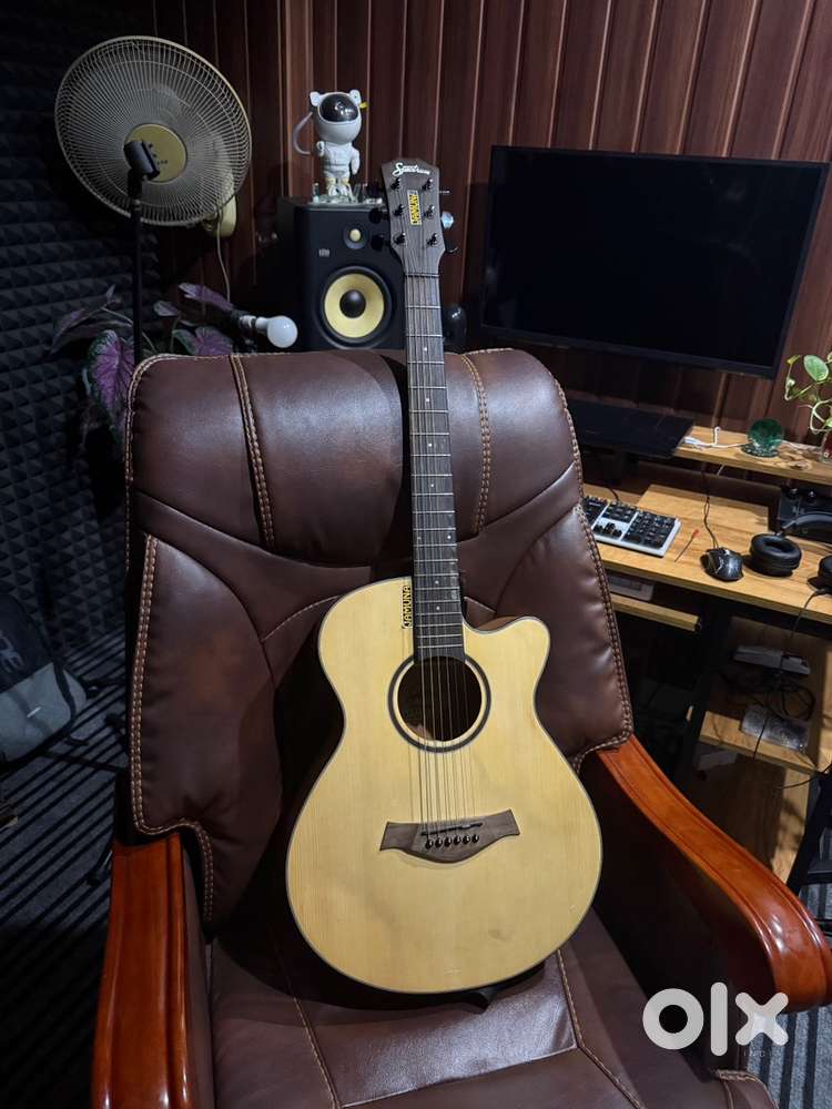 Guitar with inbuilt tuner and mixer