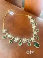 Kundan jewellery with AD and emerald green stones