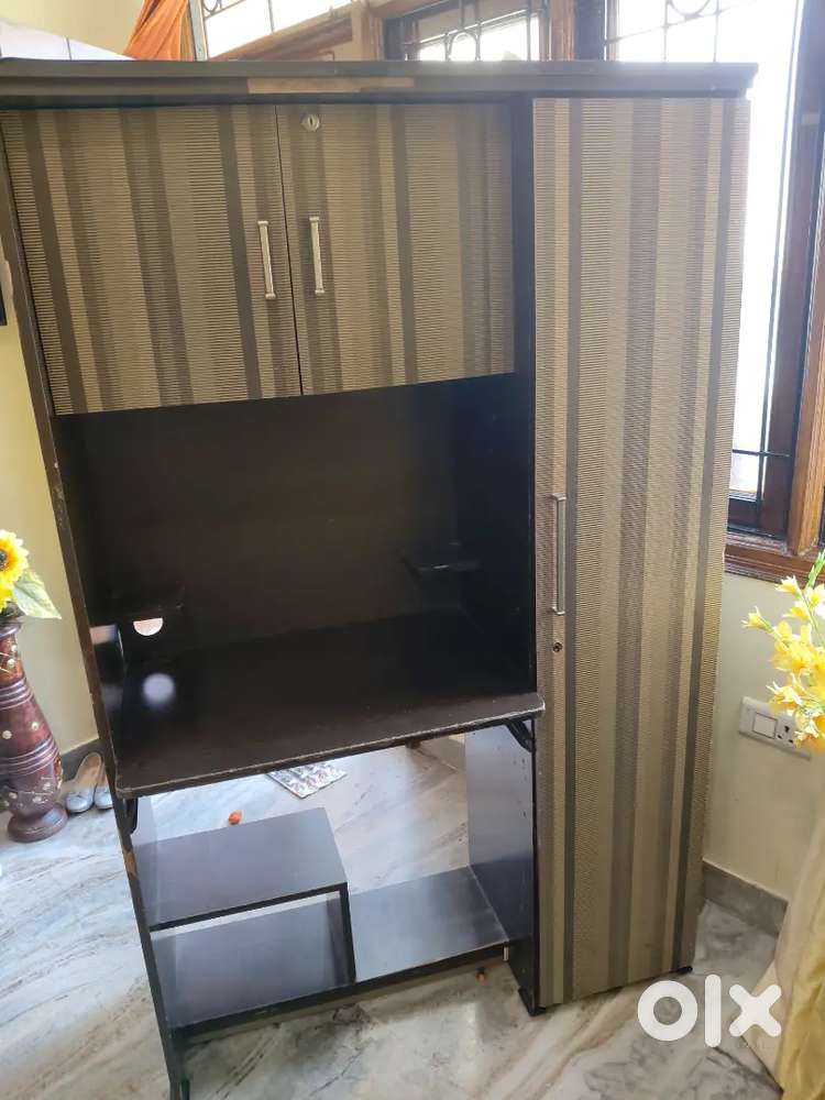 Computer table with almirah on side and storage above