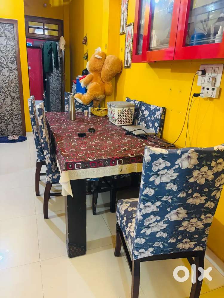 Five seater sofa with central table and six seater dinning table