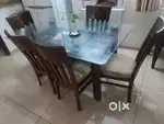 Dining table with 5 chairs, glass top table and five wooden chairs