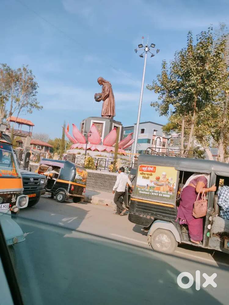 Seller at a food counter.