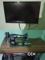 Videocon TV with Set-top Box DIsh and A Sewing Machine