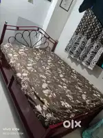 Sell king size  Iron bed 5.5 by 6.5  with big storage
