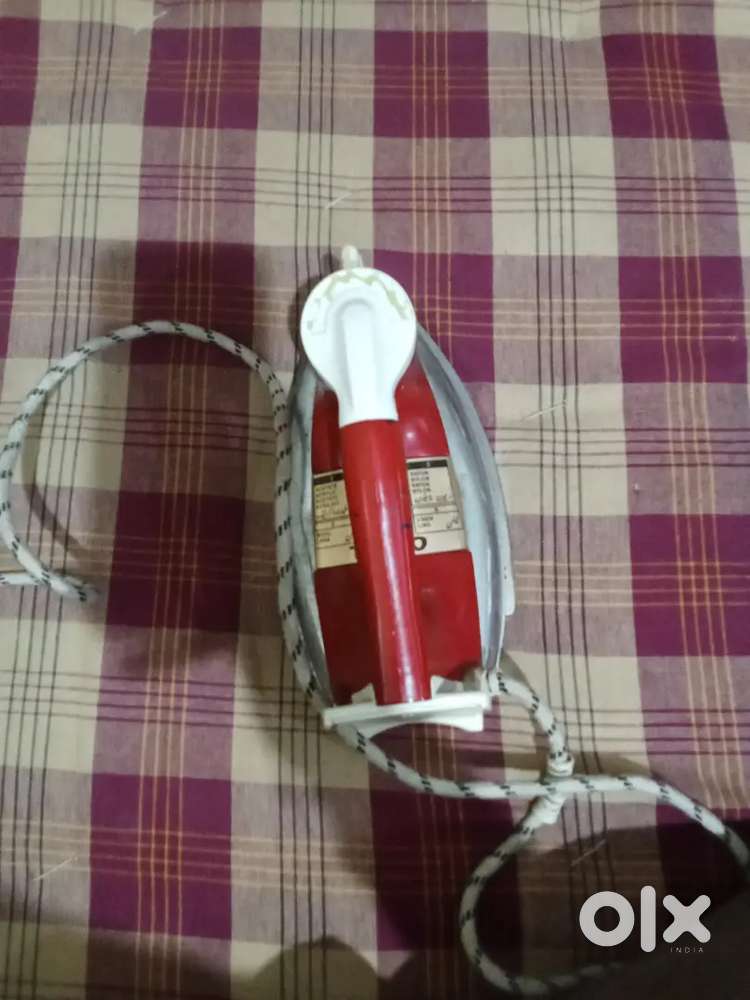 Red colour iron quantity history of weight 750 and voltage to 230