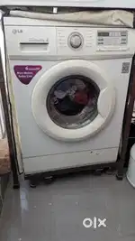LG Direct drive 6KG 10 year old front load washing machine with stand