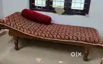 Diwan cot sofa with decorative pillow