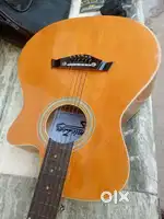 Gomic zom guitar 2 year old than new condition