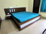 Double bed with side table and mattress