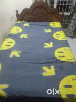 A wooden bed with 5*7 dimensions .Can easily accomodate two people