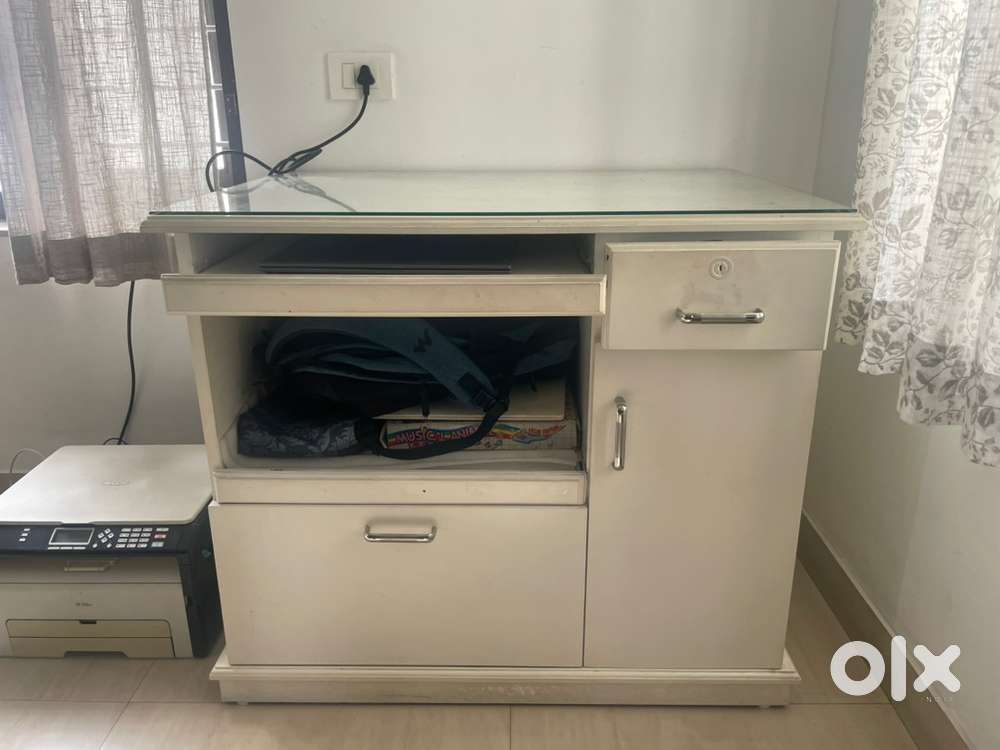 A computer table, a TV stand, a centre table and a side stand