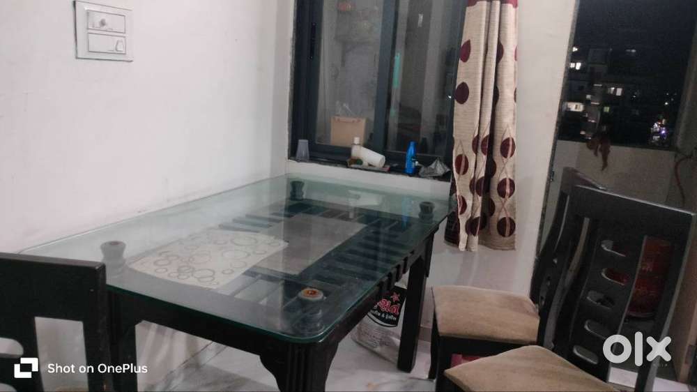 Large wooden and tempered glass dinning table with 4 chairs