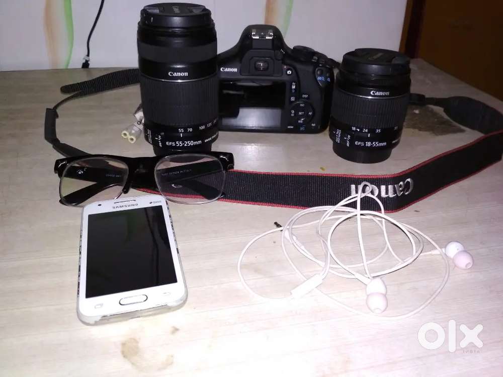 Canon EOS 1300D DSLR Camera with 2 lens as shown in img.