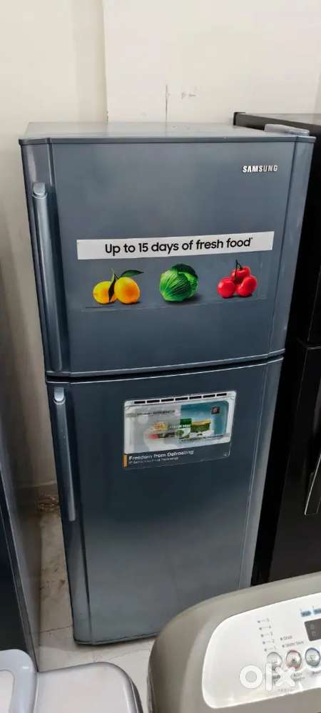 Samsung double door fridge good condition with warranty 1 year old