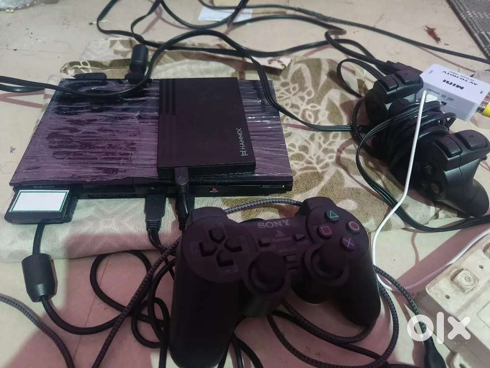 PS2 CONSOLE with 200 games 2 joy stick new one  price negotiable