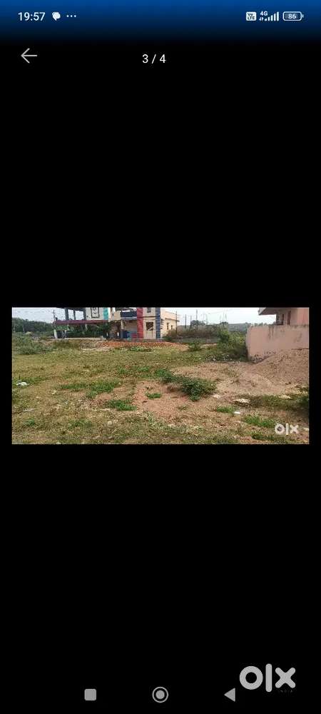 Open plot surrounded by houses is for sale