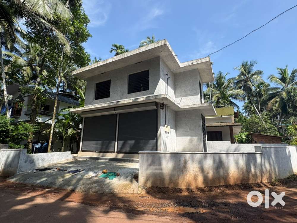 2story building with storefront shutters